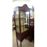 A 64cm Edwardian walnut and strung display cabinet with material lined interior enclosed by a glazed