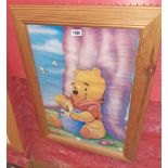 A pine framed coloured print of Winnie the Pooh