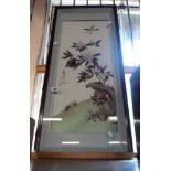 A large Japanese framed three dimensional feather picture depicting birds amongst foliage