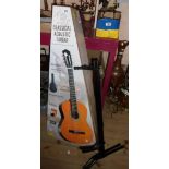 A boxed classical acoustic guitar with case - sold with a folding guitar stand