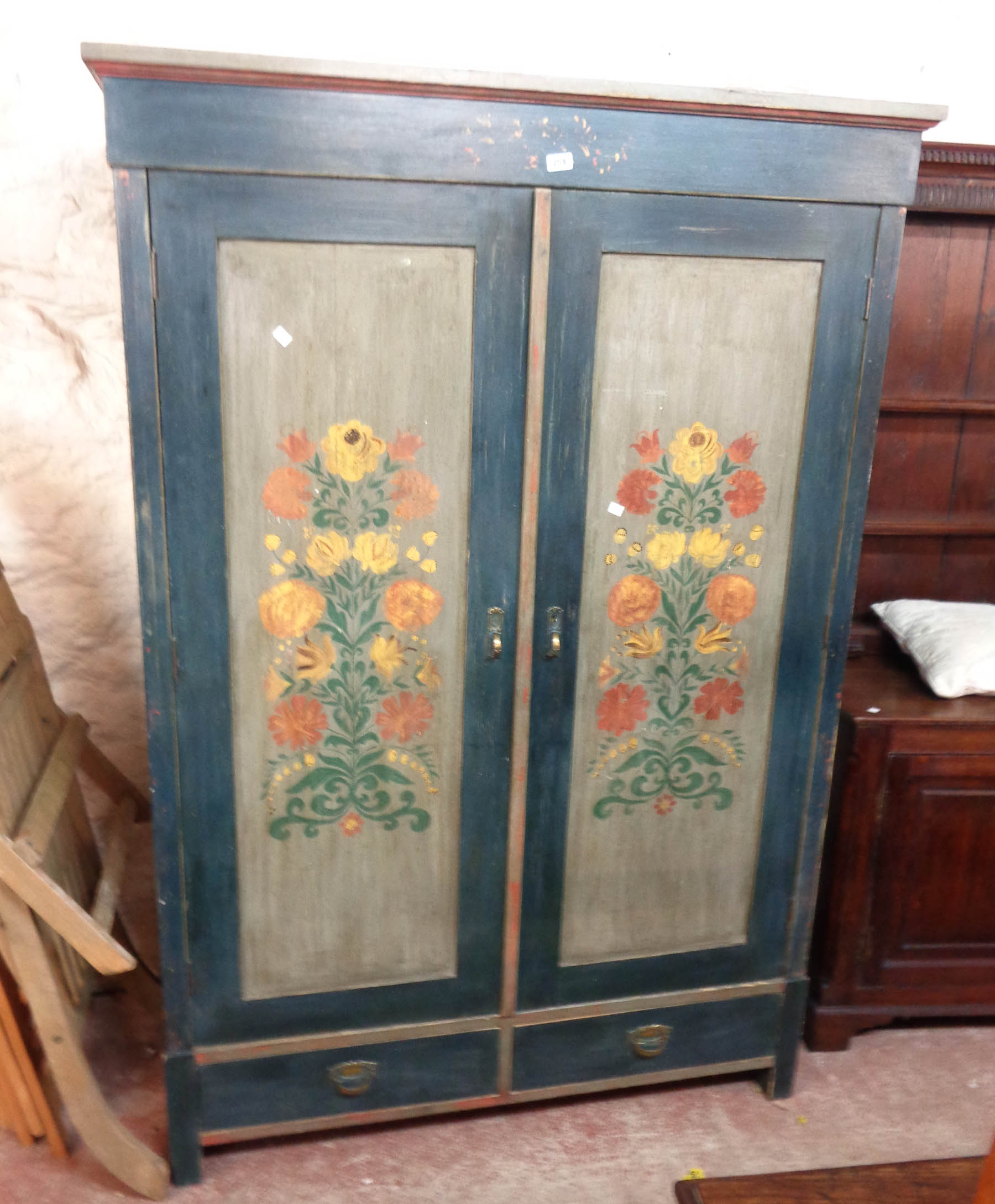 A 1.27m painted wood double wardrobe with floral decoration and two drawers under