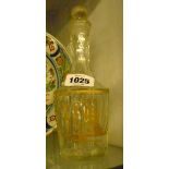 An early 19th Century cut glass table sauce bottle decorated with a gilt hunting scene