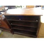 A 97cm early 20th Century stained walnut four shelf open bookcase, set on plinth base