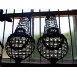 A pair of decorative 20th Century cast iron and cut glass lustre wall sconces