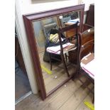 A reproduction mahogany effect and gilt line framed oblong wall mirror - 1.04m X 73cm