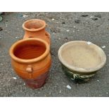 Two terracotta planters and a small terracotta strawberry pot