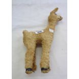 An old straw filled toy llama