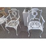 Four cast aluminium garden chairs