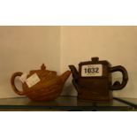 A small Chinese Yixing teapot of squared form with bamboo form spout and handle and impressed
