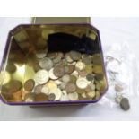 A tin containing a collection of GB and world coinage including 1889 silver crown, sixteen