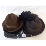 A bag containing four vintage hats