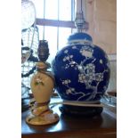 A modern Chinese porcelain table lamp of ginger jar form and carved hardwood base - sold with a