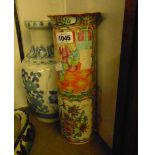 A 19th Century Chinese Canton cylindrical vase decorated in typical palette with figures and