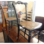 A pair of Victorian ebonised and abalone inlaid wooden framed boudoir chairs with rattan seat