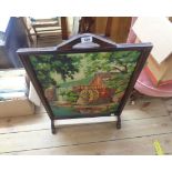 A 20th Century stained wood firescreen with painting by numbers mill scene to centre