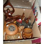 A box containing assorted treen items including figures, bowls, animals, etc.