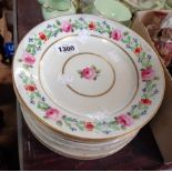 Eleven 19th Century Crown Derby porcelain plates decorated with roses and floral sprays