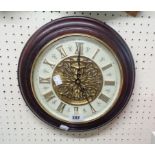 A polished wood cased Seiko battery wall clock playing numerous festive tunes and others