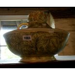 A Doulton Burslem Doulton & Slaters jug and bowl decorated with a textured floral pattern design -