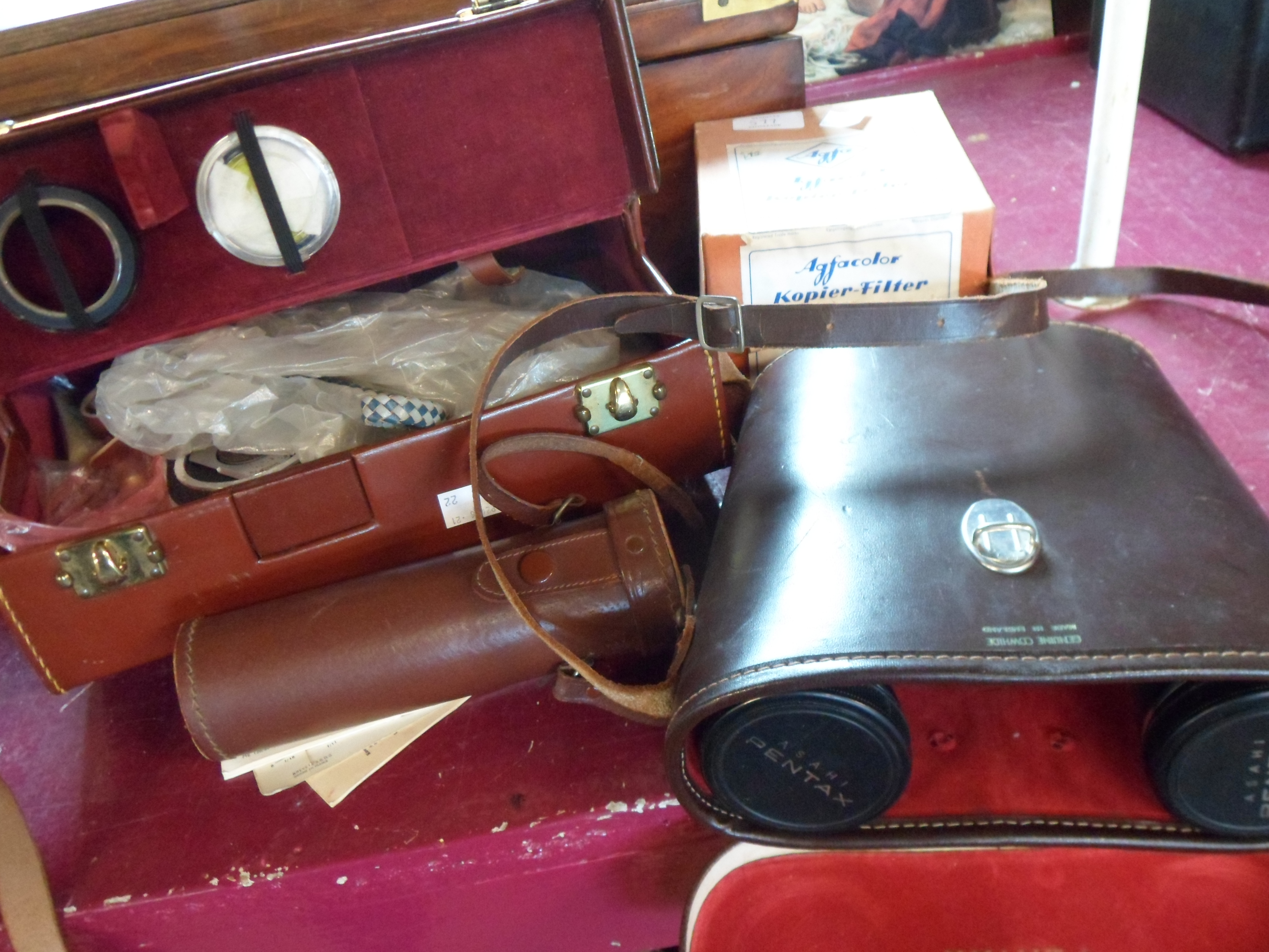 A vintage Bowlex zoom reflex cine camera - sold with a box of Agfa filters, a telescope and pair