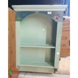 A 59cm painted wood wall mounted shelf unit with decorative top and reeded sides