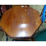 A 68cm Edwardian varnished walnut octagonal topped occasional table - legs reduced as a tea table