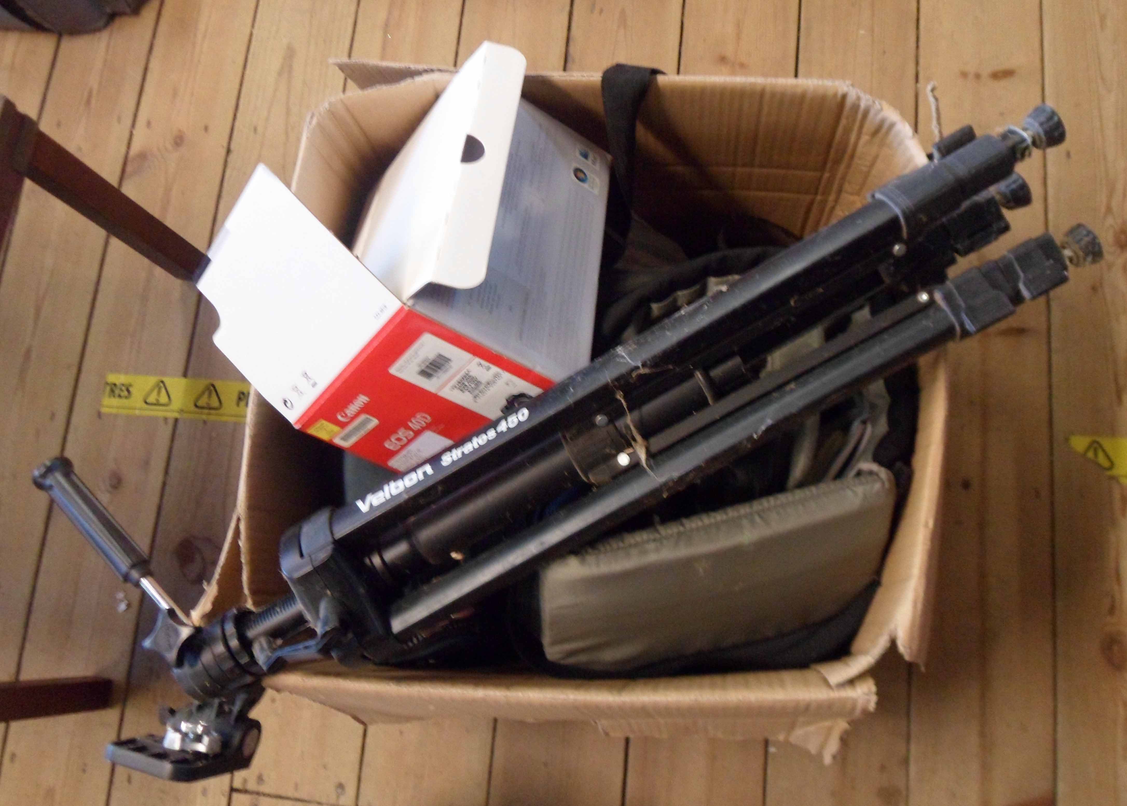 A box containing assorted cameras and equipment including Canon EOS 40D with Sigma 200mm lens, a