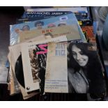 A selection of LP records including Boney M, John Lennon, Supertramp, Madness, Kate Bush, Neil