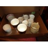 A box containing a selection of Royal Commemorative mugs