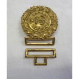 A gilt metal Royal Navy belt buckle with double wreath