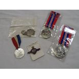 Two Second World War period 1939-1945 medals, British Legion badge, 1935 Jubilee medal, etc.