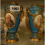 A pair of French porcelain vases decorated in the Sevres style, both with central dual framed