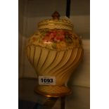 A Royal Worcester blush ivory potpourri vase and covers decorated with hand painted floral sprays