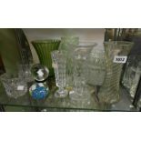 A quantity of assorted glassware including cut and moulded vases, paperweights, etc.