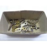 A box containing a small selection of clock keys