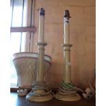 A pair of 20th Century turned wood and painted candlestick form table lamps with shades