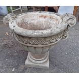 A concrete classical urn planter