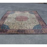 A vintage Axminster machine made Persian pattern rug with central medallion and profuse foliate