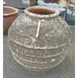 A 45cm diameter Cretan terracotta ribbed bulbous garden pot