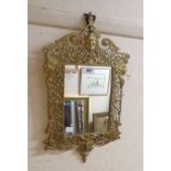 A 50cm high Victorian style ornate cast brass framed wall mirror with modern plate and