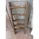 A vintage folding wooden step ladder with iron hinges - sold for display use only