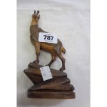 An early 20th Century Black Forest carved wood figure of a deer