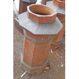 A large salt glazed stoneware chimney pot of pagoda form
