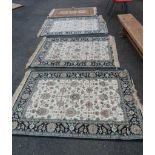 Three matching machine made Persian pattern rugs - 1.4m X 95cm - sold with another with guls on