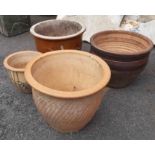 Three large garden planters of various design - sold with a another small