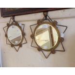 A pair of old gilt metal framed bevelled wall mirrors with 20cm diameter plates within open star