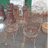 A set of four old high backed wire work garden chairs with remains of original paint
