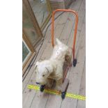 A vintage Triang push along ride on plush dog - played with condition