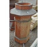 A large salt glazed stoneware chimney pot of pagoda form