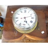 A 20cm diameter vintage Smiths (Cricklewood) bulkhead timepiece with silvered bezel and brass